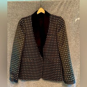 This is a slim cut men’s blazer.